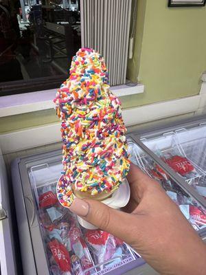 Vanilla soft serve with rainbow sprinkles (delicious)