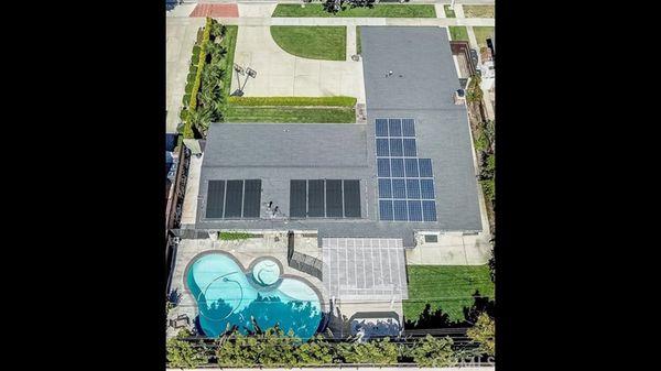 Aerial view with solar panels for home and pool