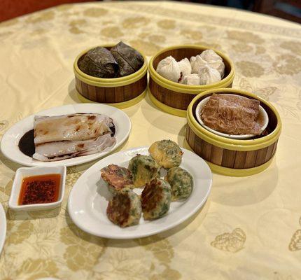 Sticky rice in lotus leaf, steamed roast pork bun, beancurd rolls fried, chive pork dumplings, beef rice roll.