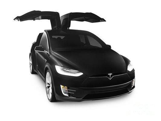 Book the Tesla Model X today! Falcon doors, and room for 6!