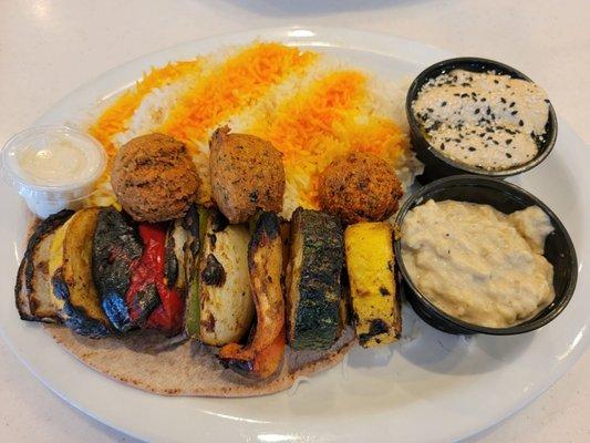 falafel plate with hummus and baba ganoush as the sides