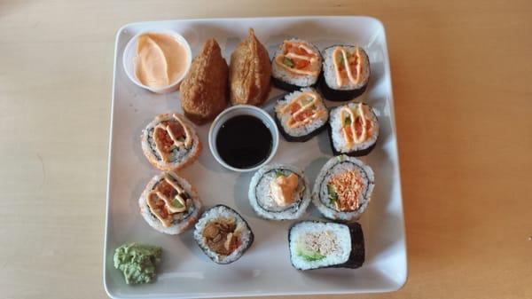 Got this for dinner. Spicy tuna & salmon,  spicy crab, tuna avacado,  deep fried tofu - kinda has a sweet taste. Cost about $8.