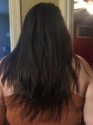 The layers are very uneven in length and there is a inch of hair at the bottom that looks like she just forgot to cut it.