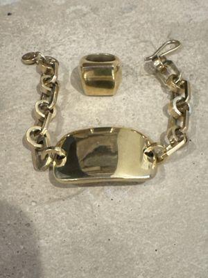 Tag link bracelet and pinky ring.