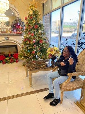 My mom in the waiting area of the salon around Christmas.