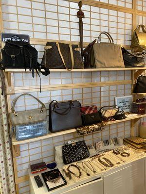 Our designer handbag wall. Selection is always changing!