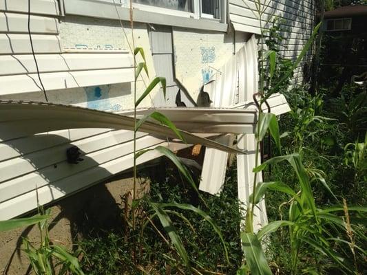 damage to the exterior of the house in Westbury NY from a fire in the basement.