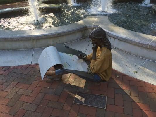 Bronze statue by fountain