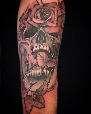 Skull and rose by Mister Swan