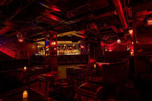 Experience a world of intrigue and charm at the speakeasy hidden beneath the Ivory Peacock Bar