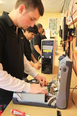 YouthMedia students refurbish computers, create webpages, design marketing materials and other fun client projects.