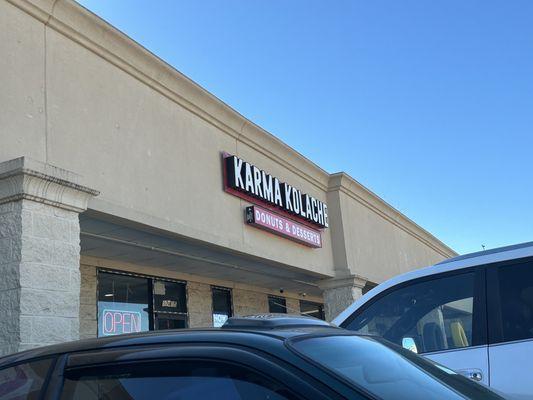 Outside - in between hair salon and auto body (or tire shop)