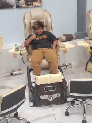 My son loving the massage chair