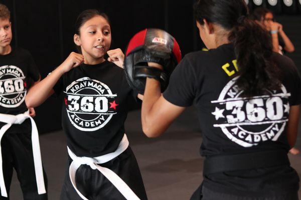 Melissa working elbows on the mitts.