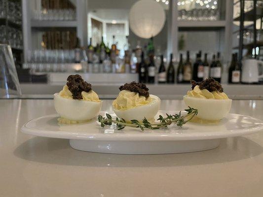 Deviled eggs with shaved truffles