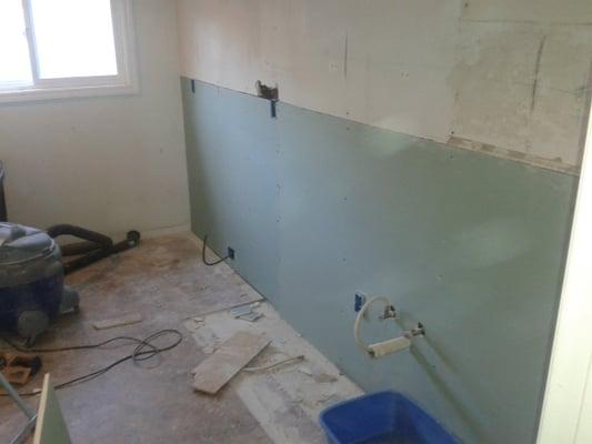 Kitchen walls had mold and replaced with mold resistant drywall.