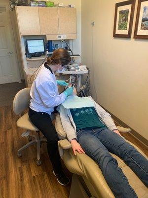 One of our hygienists, Jennifer, doing what she does best!