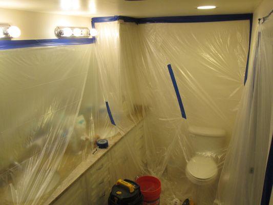 The entire bathroom is wrapped in plastic to minimize the mess.