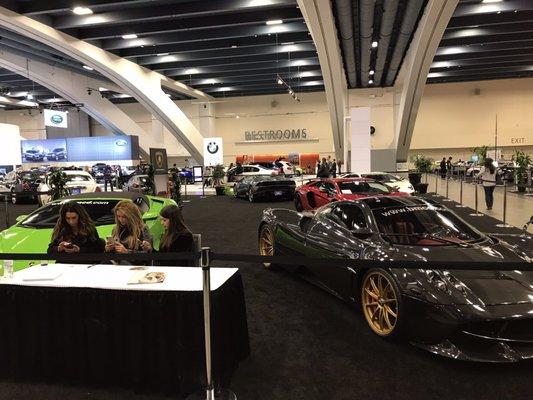 A great contrast to the SF International Auto Show of 2017. Car models on their phones, a BMW display, and the restrooms behind it all.