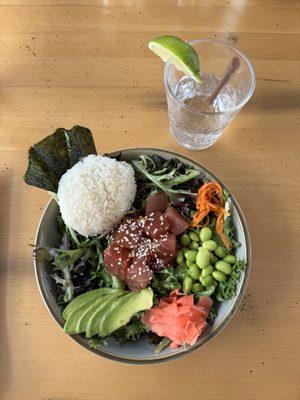 TUNA POKÉ sushi grade tuna in a garlic, ginger, soy and sesame sauce, with cucumber water brined carrots, ginger, avocado, nori, sushi rice