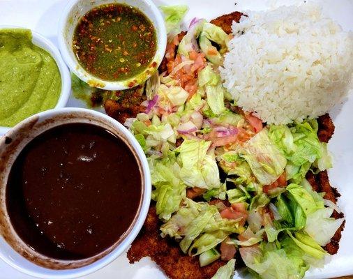 Fried Thin Chicken Cutlet topped with salad