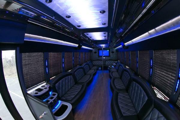 interior of 32 passenger partybus with Purple Rain interior