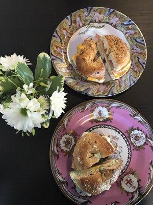 Top-everything bagel with ham, cheddar and egg Bottom- energy whole wheat bagel with chives cream cheese, egg and lox