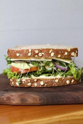 The Berkeley  Tomato, Onion, Avocado, Hummus, Micro Greens, Secret Sauce on Whole Grain Bread. (Vegan)