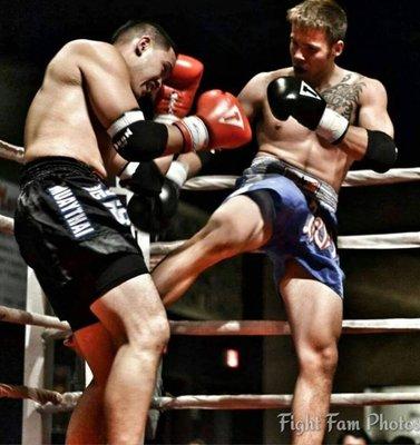 Kyler Tae sorn(cut kick) his opponent in a Muaythai fight