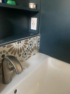 Tile accent added to match cabinets and shower.