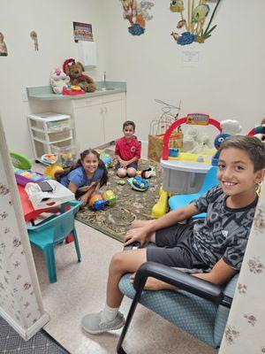 My kids in the playroom entertained while Dr. Joshua does dental work on mom & dad