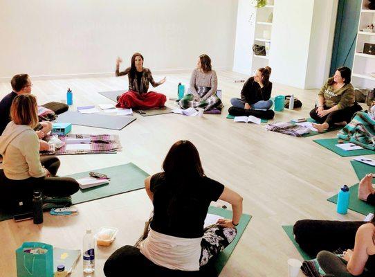 Leading a breathwork teacher training certification.