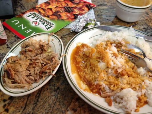 Pernil (roasted pork shoulder) with rice and beans.