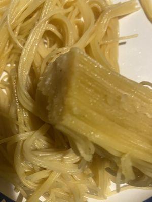 Raw capellini pasta.