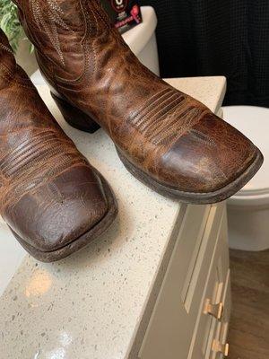 the boots he recently fixed for me. you can see the boot in the picture on the Left is a bit darker but 100% Better than before.