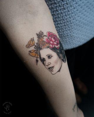 Princess Leia with flowers tattoo.