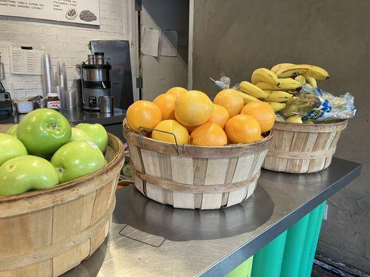 Fruits in front of the smoothie & juice section