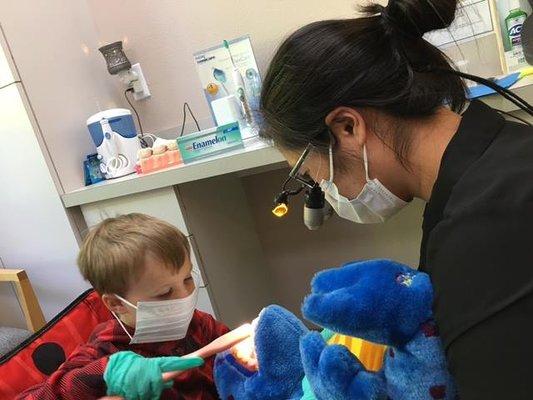 Dr. Houser with one of her patients working on brushing!