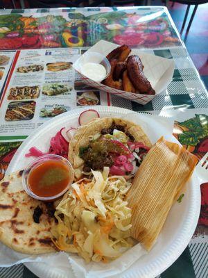 Combo plate with a taco, popular, and tamal!