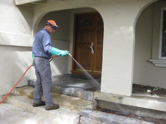 Powerspraying the perimeter of the home