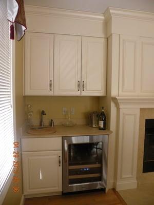 Painted cream color cabinets  Bar area with stainless steel wine cooler