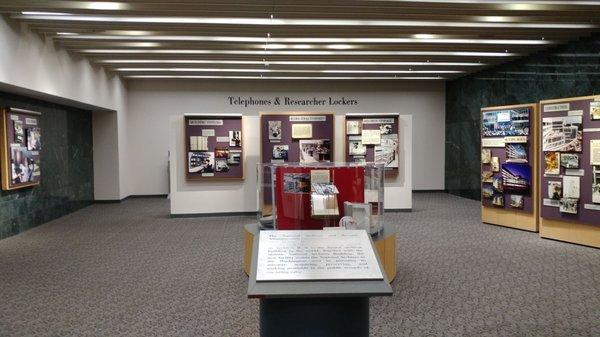 Small exhibit on the history of the Archives location by the researcher locker area.