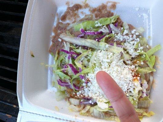 Thats my pinky finger right abov the tostado. Shows how tiny it is. I could have got 5 from Del Taco the same size for the same price.