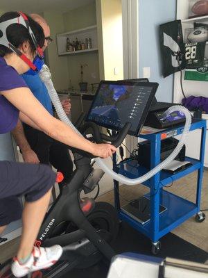 A home visit to a client looking to fine tune workout zones using the Peloton Bike