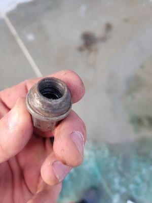 The stripped lug nut.   Cause you know. You can't trust a mechanic to put a nut on correctly.