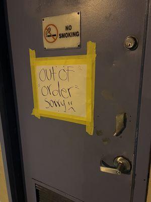 Door with an out of order sign. Looks like it was a restroom in a former life.