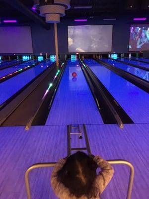 Toddler enjoying bowling with bumpers!