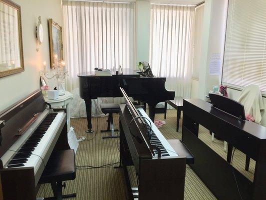 Our lesson room BOSTON baby grand piano & 4 YAMAHA digital pianos