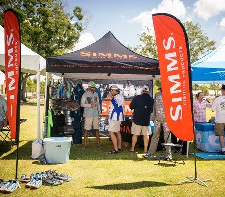 Pop up tent with 9 foot tear drop flags.