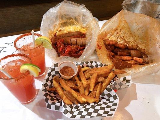 1lb  , 1lb  , 4 sausages, medium spicy, and Cajun fries with Micheladas to wash everything down!